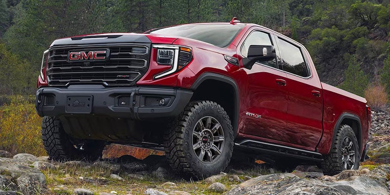 Image of GMC Sierra_1500 parked on rocks in valley