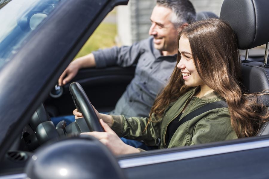 Teen driving a car