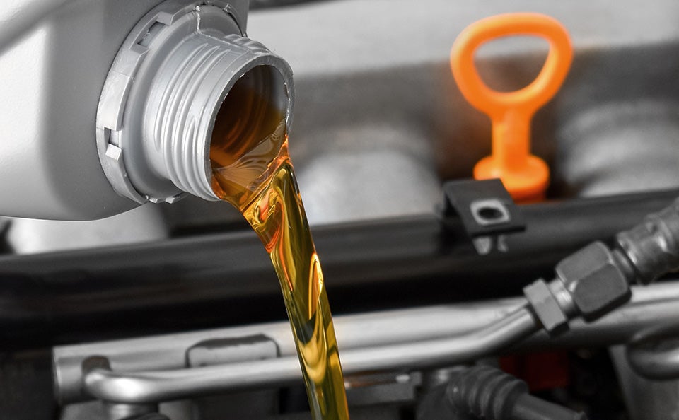 Image of new oil pouring in engine